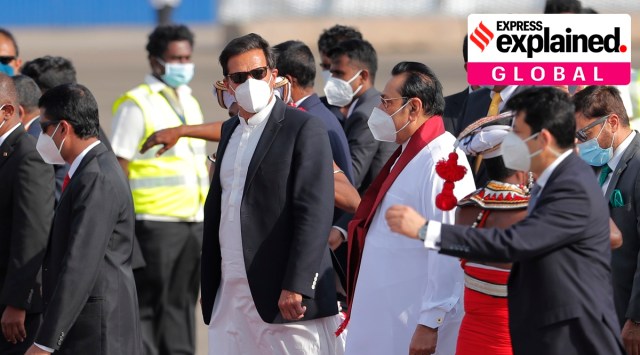 Pakistan's Prime Minister Imran Khan, center, walks with Sri Lankan Prime Minister Mahinda Rajapaksa upon his arrival in Colombo, Sri Lanka, Tuesday, Feb. 23, 2021. (AP Photo/Eranga Jayawardena)