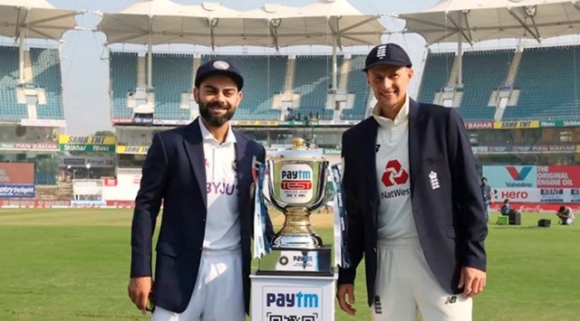 Chennai: Indian skipper Virat Kohli (L) and his England counterpart Joe Root pose for photographs with the Test trophy before the start of the first cricket test match between India and England, at MA Chidambaram Stadium in Chennai (Source: PTI)