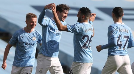 Manchester City's John Stones, second left, celebrates with teammates after scoring his side's second goal during the English Premier League soccer match between Manchester City and West Ham United at the Etihad stadium in Manchester, England, Saturday, Feb. 27, 2021. (Martin Rickett/Pool via AP)
