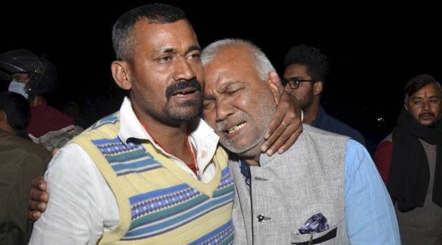 Navy sailor Suraj Kumar Dubey’s father Mithilesh after the mortal remains of his son arrived at Ranchi Airport. (PTI)