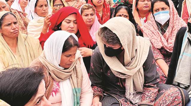 Congress general secretary Priyanka Gandhi Vadra with the family of Navreet Singh, who died during the tractor rally in Delhi on January 26, at Dibdiba village in Rampur. (Express Photo)