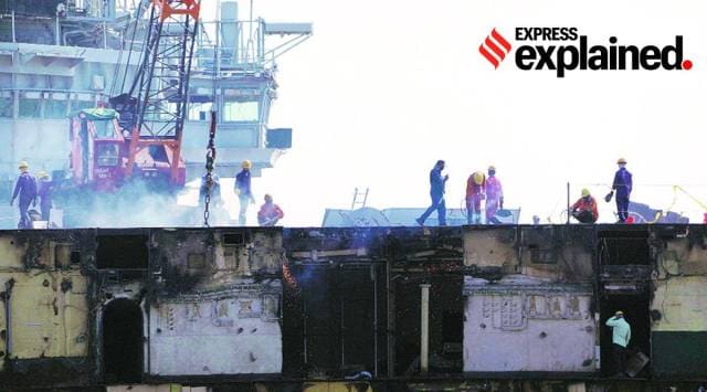 Partially broken flight deck of INS Viraat, decommissioned in March 2017, now hosts a red 30-tonne crane at the ship-breaking yard in Alang. (Photo: Nirmal Harindran)