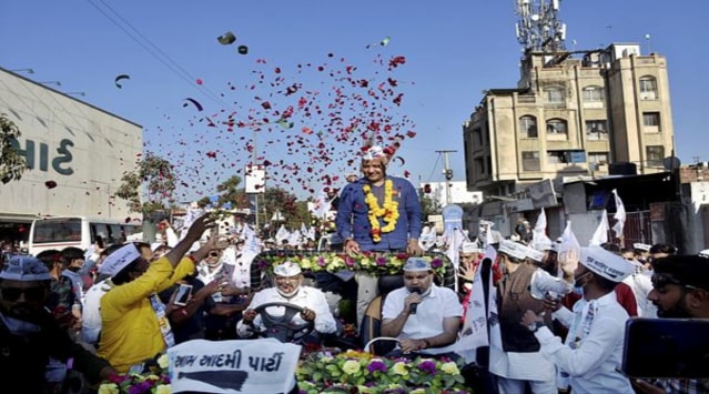 Delhi Deputy Chief Minister Manish Sisodia during a roadshow from Greenland Square to Racecourse Multistory Building Square, in Rajkot, Sunday, Feb. 7, 2021. (PTI Photo)