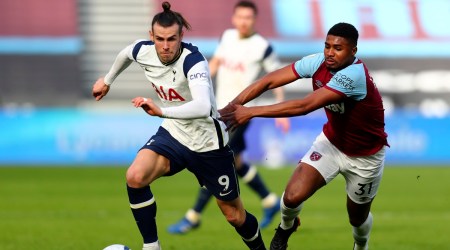Tottenham's Gareth Bale, left, duels for the ball with West Ham's Ben Johnson during the English Premier League soccer match between West Ham United and Tottenham at the London Stadium (Source: AP)