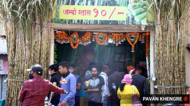 With heat on roads, motorists stop for a break to enjoy a cool glass of sugarcane juice in Pune. (Express Photo By Pavan Khengre)