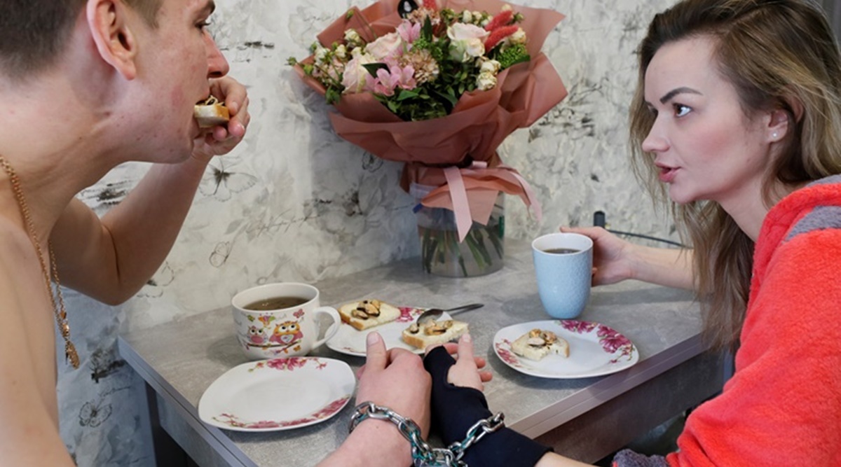 Ukrainian couple handcuffed to each other, couple handcuffed to each other, Ukraine, Bizarre news, Bizarre relationships, Trending news, Indian Express news