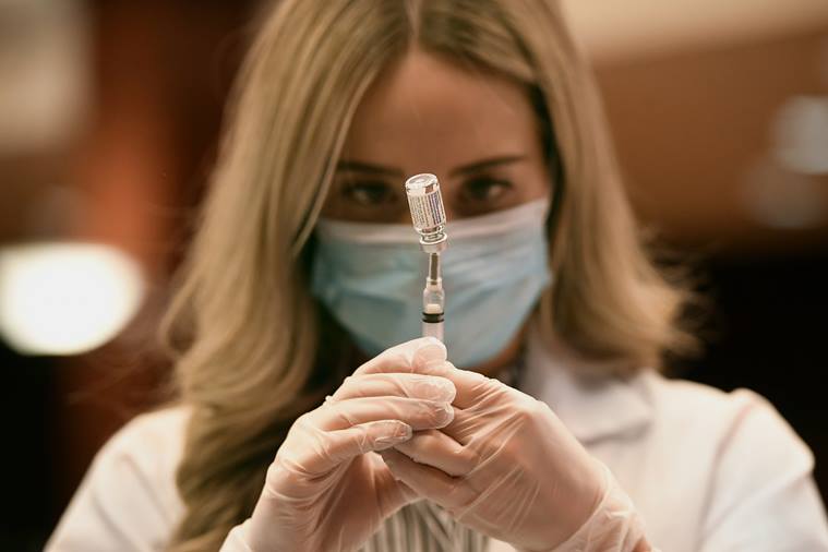 Pharmacist Madeline Acquilano draws a syringe of Johnson & Johnson COVID-19 at Hartford Hospital in Hartford, Conn., Wednesday, March 3, 2021. The first shipments of the vaccine arrived at the hospital Wednesday morning. (AP Photo/Jessica Hill)
