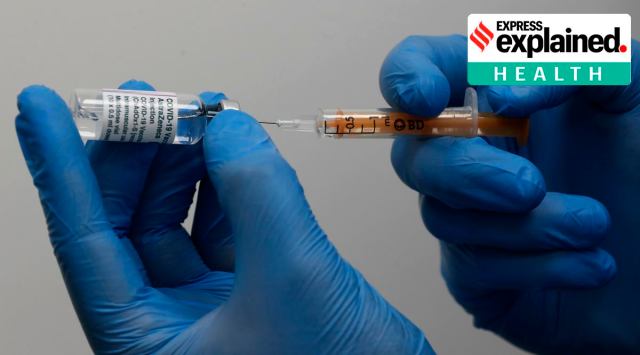 A doctor prepares the AstraZeneca vaccine at a Pharmacy in Edgeware, London, Tuesday, March 16, 2021, as Britain continues use of the vaccine. (AP Photo/Frank Augstein)