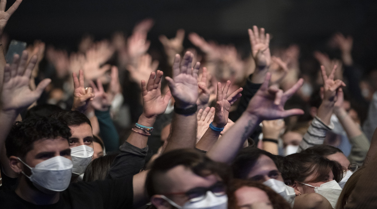 People attend a music concert in Barcelona, Spain, Saturday, March 27, 2021. (AP Photo/Emilio Morenatti)