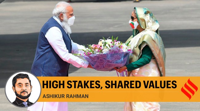 Prime Minister Narendra Modi receives a bouquet of flowers from Bangladesh's Prime Minister Sheikh Hasina in Dhaka, Bangladesh, Friday, March 26, 2021. (Twitter @narendramodi)