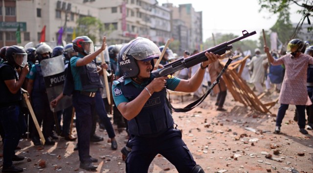 Security personnel  disperse demonstrators protesting against the visit of Prime Minister Narendra Modi, in Dhaka on Friday. (AP)