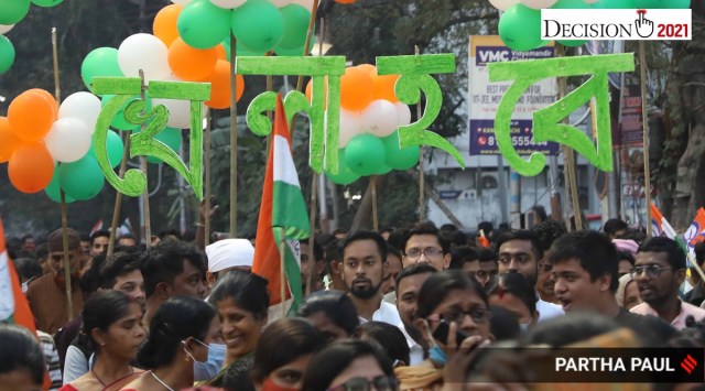 Trinamool Congress workers taking out a rally in Kolkata with Khela Hobe cutouts. (Express photo by Partha Paul)