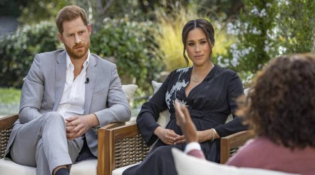 This image provided by Harpo Productions shows Prince Harry, left, and Meghan, Duchess of Sussex, in conversation with Oprah Winfrey. (Joe Pugliese/Harpo Productions via AP, File)