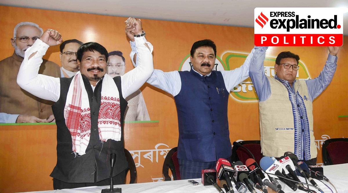 BJP president Ranjit Kumar Dass (C), Assam Gana Parishad president Atul Bora (L) and UPPL president Promod Boro (R) raise hands for their alliance for Assembly polls, during a press conference, in Guwahati, Sunday, March 7, 2021. (PTI Photo)