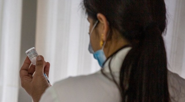 A healthcare worker prepares to administer a COVAXIN vaccine, developed by Indian company Bharat Biotech, at a private hospital in India (AP Photo/Altaf Qadri)