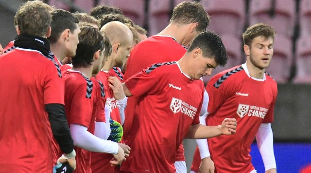 Denmark's National team players wear shirts reading "Football supports change". (AP Photo)