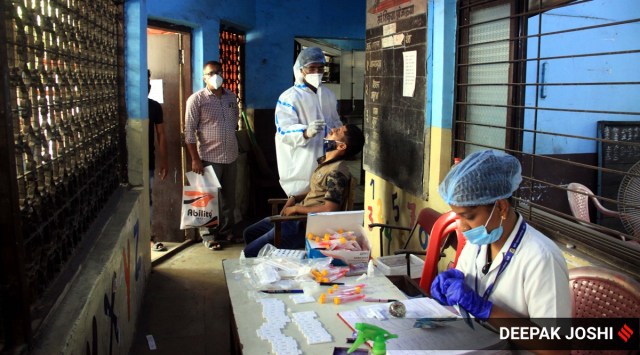 TMC healthcare staff collect swabs at a school in Thane (Express photo by Deepak Joshi)