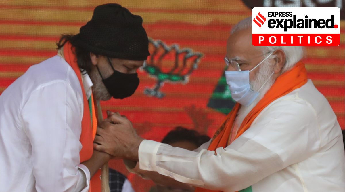 Actor Mithun Chakraborty with PM Narendra Modi at a rally in Kolkata. (Express photo by Partha Paul)