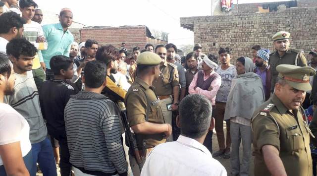 Police personnel at the crime scene at Ambedkarnagar colony in Bulandshahr district on Wednesday. (PTI)