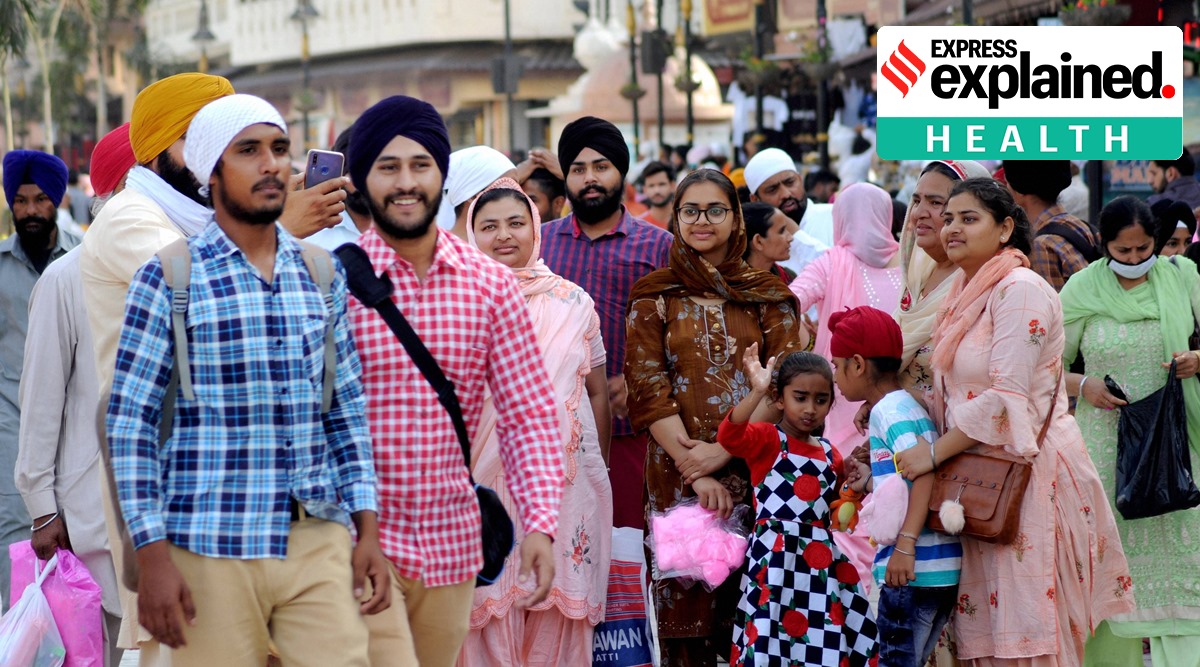 People, not wearing face masks, walk at the Heritage Street near Golden Temple, amid coronavirus pandemic, in Amritsar, Friday, March 19, 2021. (PTI Photo)