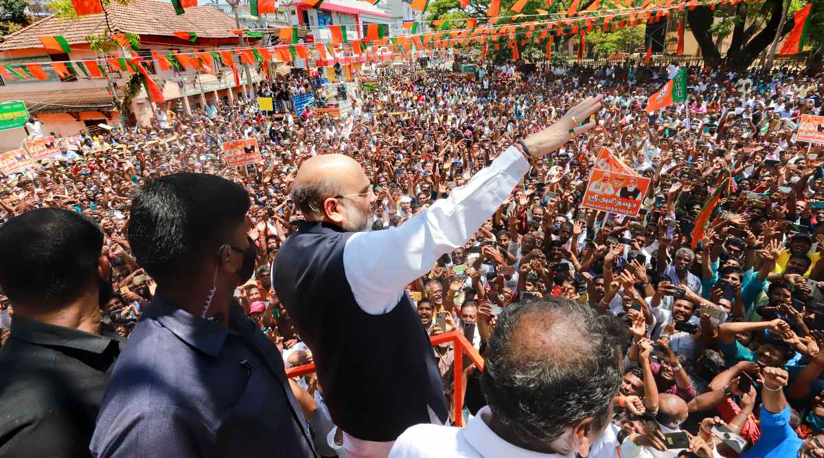 Union Home Minister and senior BJP leader Amit Shah waves at supporters during his election campaign roadshow at Nagercoil, Kanyakumari, Sunday, March 7, 2021. (PTI Photo)