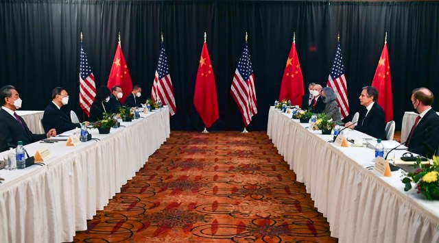 Secretary of State Antony Blinken, second from right, joined by national security adviser Jake Sullivan, right, speaks while facing Chinese Communist Party foreign affairs chief Yang Jiechi, second from left, and China's State Councilor Wang Yi, left, at the opening session of US-China talks at the Captain Cook Hotel in Anchorage, Alaska, Thursday, March 18, 2021. (Frederic J. Brown/Pool via AP)