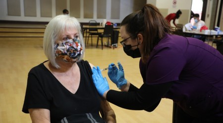 A person receives a Pfizer-BioNTech COVID-19 vaccination at the Community Center in Rohnert Park, Calif., on Jan. 27, 2021. (The New York Times: Jim Wilson)