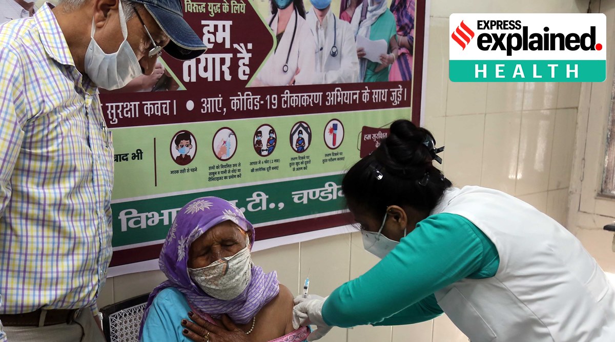 A senior citizen takes the first dose of Covid-19 vaccine at government dispensary Dadumajra in Chandigarh. (Express Photo: Kamleshwar Singh)