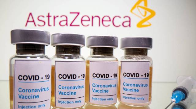 Vials with a sticker reading, "COVID-19 / Coronavirus vaccine / Injection only" and a medical syringe are seen in front of a displayed AstraZeneca logo in this illustration taken October 31, 2020. (REUTERS)