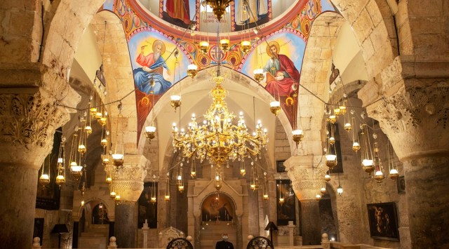 Father Samuel Aghoyan, the Armenian superior at the Church of the Holy Sepulchre looks up as he stands at the Saint Helena chapel. (Photo: Reuters)