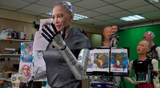 Sophia uses a brush to paint at Hanson Robotics studio in Hong Kong. (Photo: AP)
