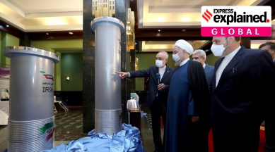 In this photo released by the official website of the office of the Iranian Presidency, President Hassan Rouhani, second right, listens to head of the Atomic Energy Organization of Iran Ali Akbar Salehi while visiting an exhibition of Iran's new nuclear achievements in Tehran (Iranian Presidency Office via AP)