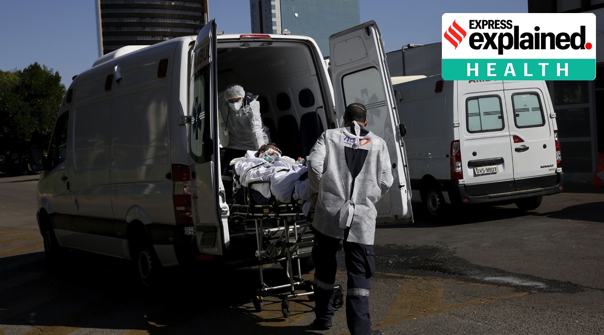 A patient suspected of having COVID-19, is transferred from an ambulance into the HRAN public hospital in Brasilia, Brazil (AP)