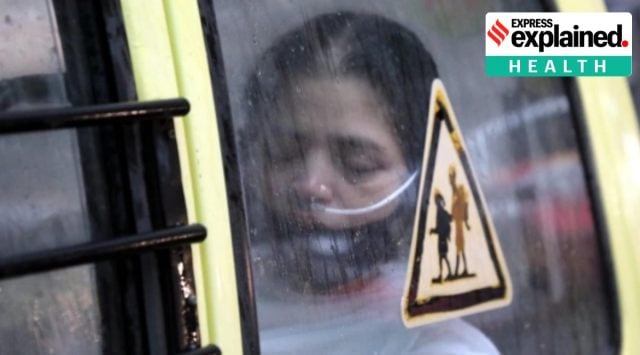 A woman is given oxygen inside a car amid the Covid-19 pandemic in India (Express Photo)