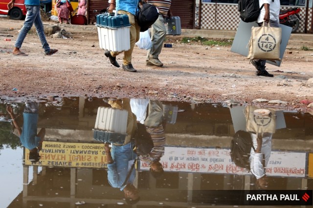 Election officials carrying EVM machines   on their way to their booth from Cooch Behar Polytechnic  DC ,RC & counting Centre in Cooch Behar on April 09,2021.Express photo by Partha Paul.