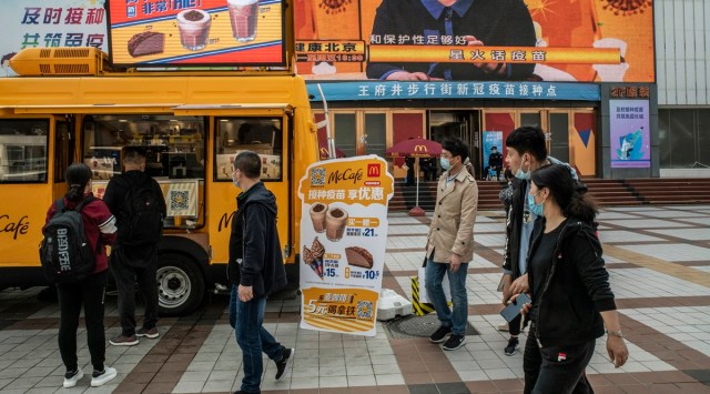 A McDonald’s ice cream truck outside a vaccination center in Beijing on Tuesday, April 6, 2021, offers a two-for-one promotion for those getting a COVID-19 vaccine. (Gilles Sabrie/The New York Times)