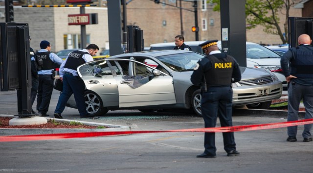 Police investigate a crime scene where Jontae Adams, 28, and his daughter, Jaslyn, 7, where shot, resulting in Jaslyn’s death at a McDonald’s drive thru at the corner of W Roosevelt Rd and South Kedzie Ave. (AP)