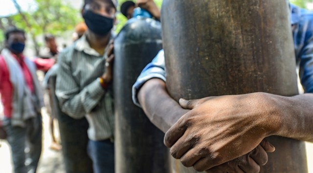 Kanpur: Family members of COVID-19 patients wait to fill their empty cylinders with medical oxygen outside an oxygen filling center, as demand for the gas rises due to spike in coronavirus cases, in Kanpur,Thursday, April 22, 2021. (PTI)