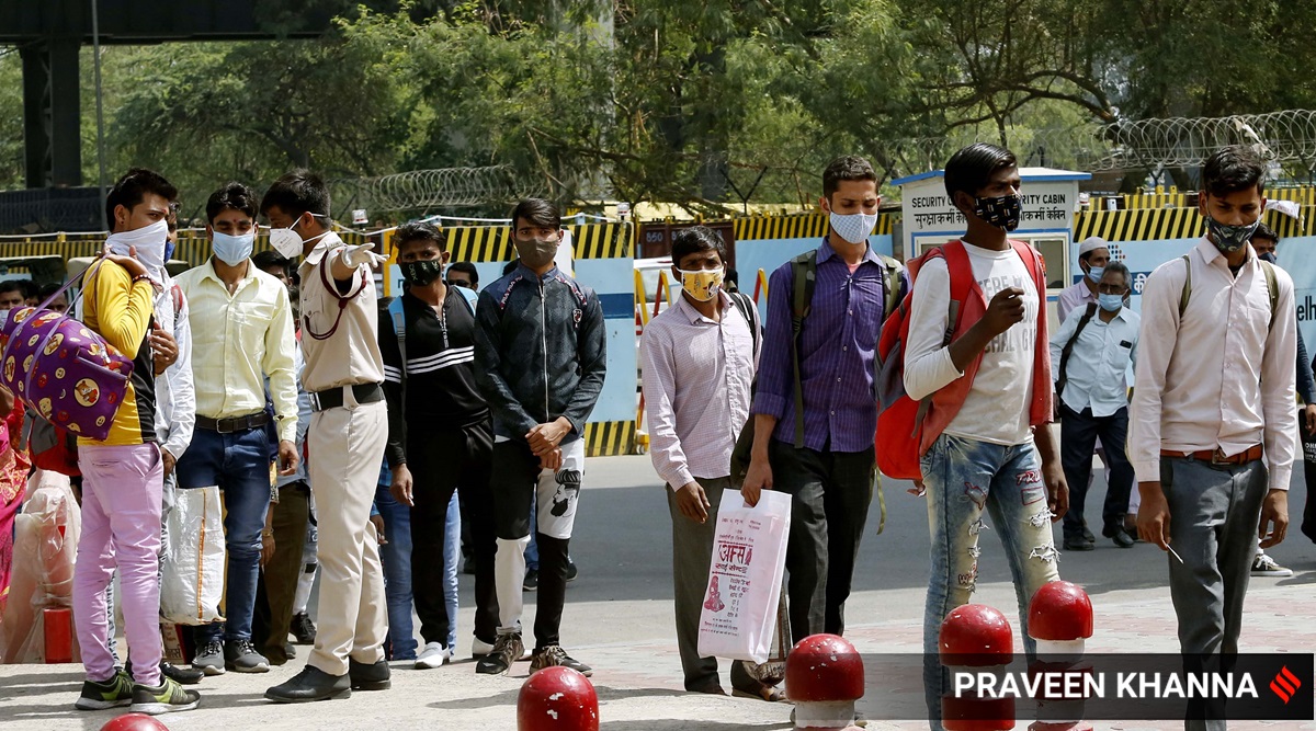 Testing for Covid-19 at Anand Vihar bus terminal in New Delhi on Wednesday. (Express Photo: Praveen Khanna)
