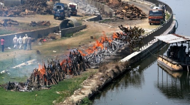 The final rites of Covid-19 victims being performed at a cremation ground in Lucknow. (Express Photo: Vishal Srivastav) 