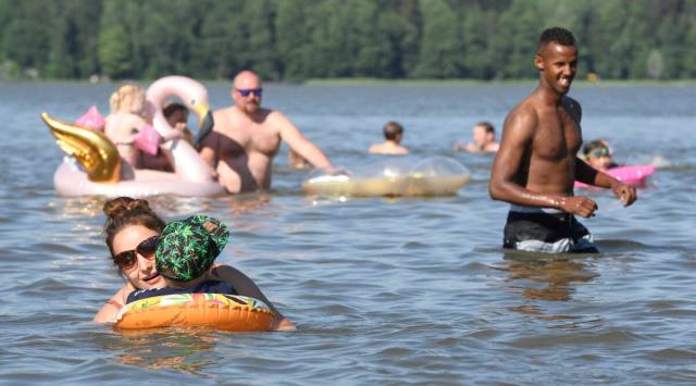 People enjoy in a lake in Espoo, Finland. (AP)