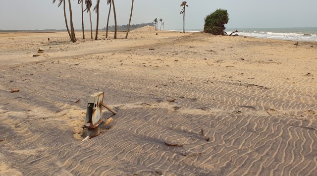 The hand pump buried in sand at Satabhaya in  Odisha’s Kendrapara district. (Express Photo:  Aishwarya Mohanty)
