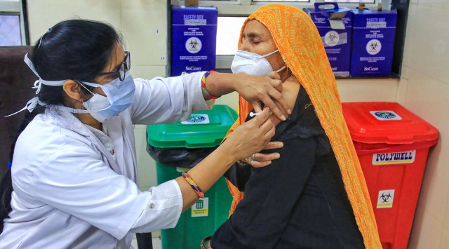 A healthcare worker administers a dose of a Covid-19 vaccine in Jaipur. (PTI)