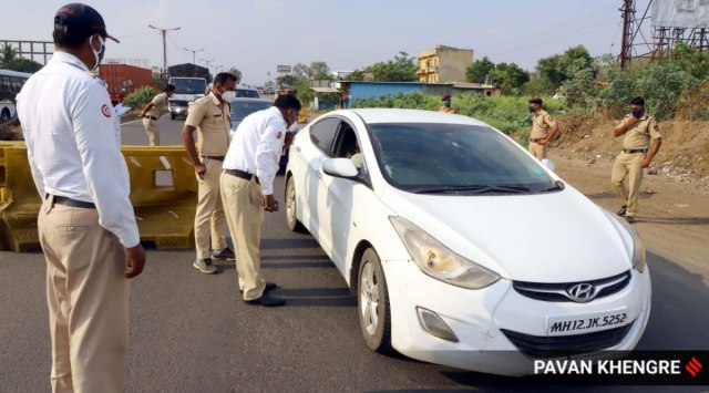 Pune Rural Police checks travel E-pass near Shivapur toll plaza on Pune-Satara  Highway. 