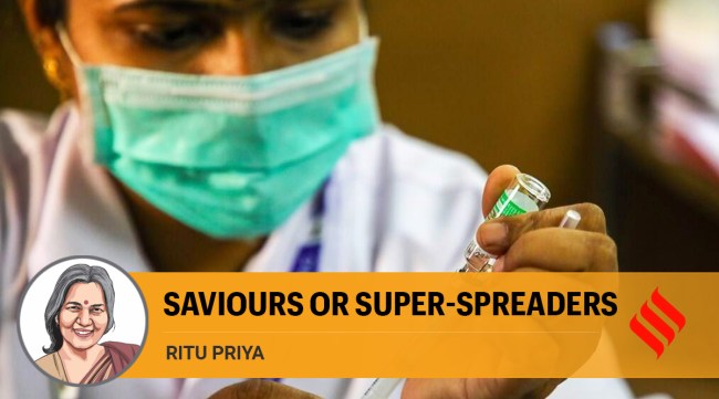 A healthcare worker administers a dose of Covid-19 vaccine in Pune (Express Photo: Ashish Kale)