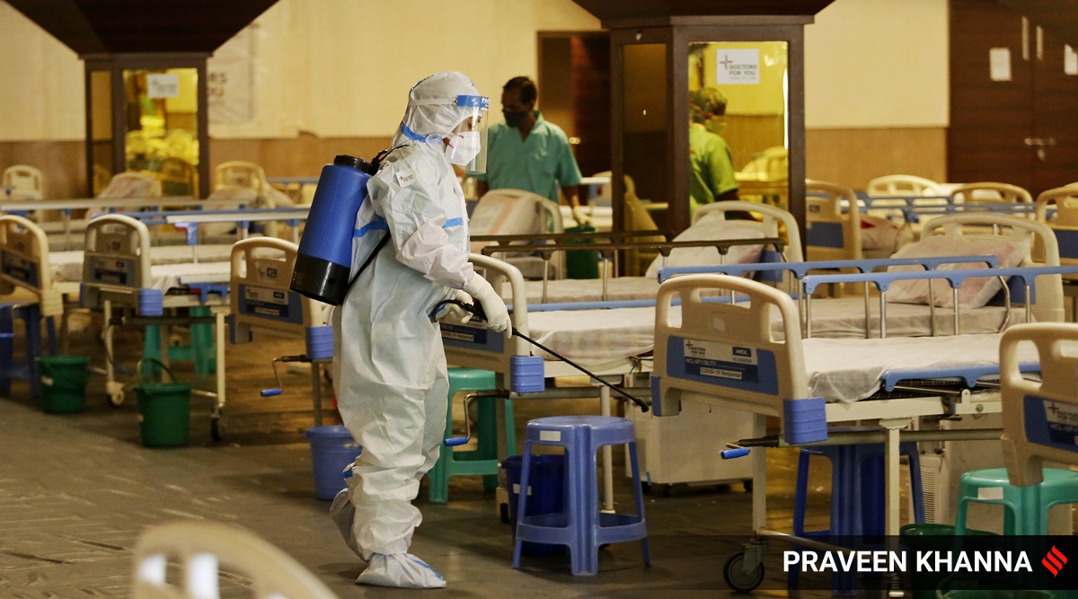 Santitaion underway at Shehnai Banquet Hall which is converted into isolation ward for Covid-19 patients in New Delhi (Express photo/Praveen Khanna)