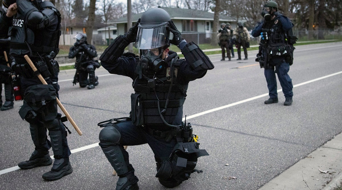 Police stand guard in the neighbourhood in Minneapolis where where Daunte Wright was killed. (AP) 