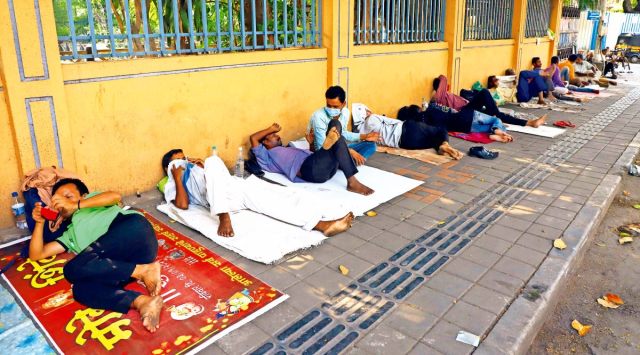 Homeless persons sleep on Bajirao Road as markets remain shut due to the ongoing Covid restrictions in Pune, Saturday. (Express Photo by Pavan Khengre)