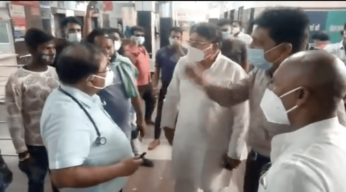 A screen grab from a video of the incident, which has since gone viral, in which a group of Congress leaders, including PC Sharma, are seen yelling at Dr. Yogendra Shrivastav. (Picture: Twitter/@DrRitikaPandey)
