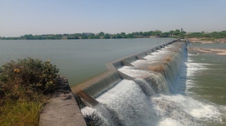 Tankara: A checkdam overflows after Narmada water was pumped into it through SAUNI pipeline, in Tankara taluka of Morbi district. (Express Photo)